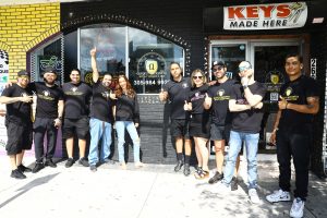 Quickly Locksmith Miami team members outside the store front in Miami downtown 