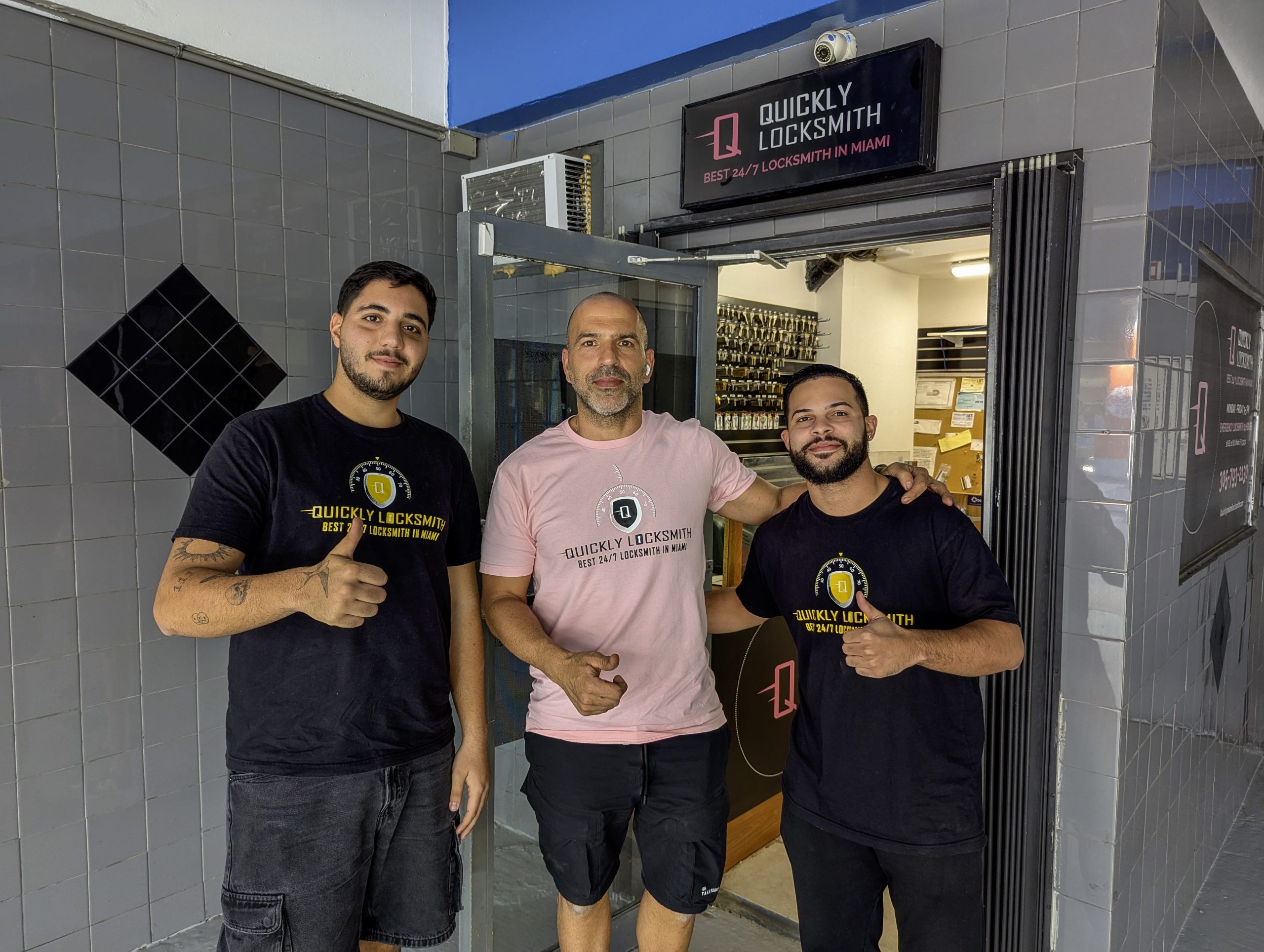 Quickly Locksmith Miami Owner with his technicians outside locksmith store in Downtown Miami FL